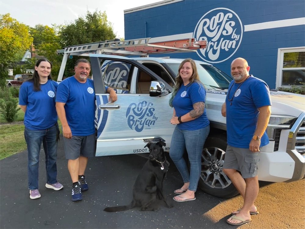 Roofs By Bryan team photo by company truck