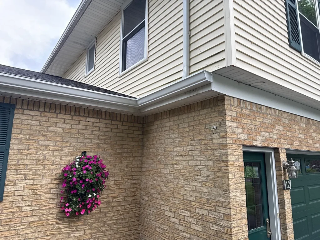 Seamless gutters installed along the roofline after gutter replacement in Angola, NY
