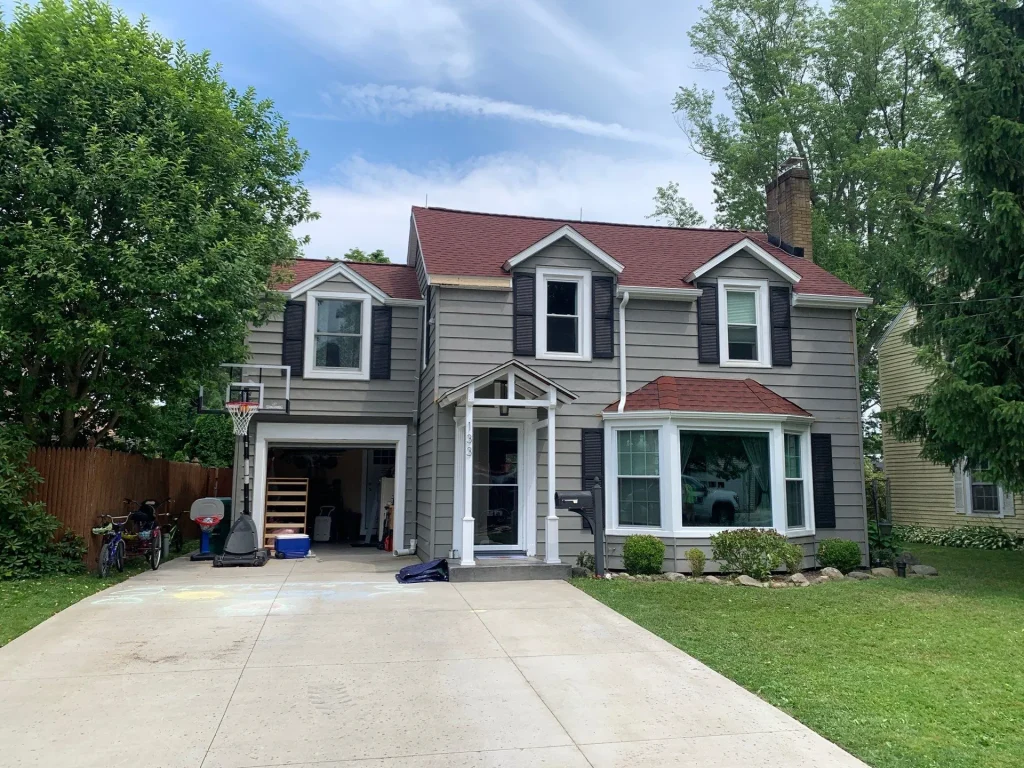 Hamburg, NY home with new GAF HDZ Patriot Red shingle roof and rebuilt eaves