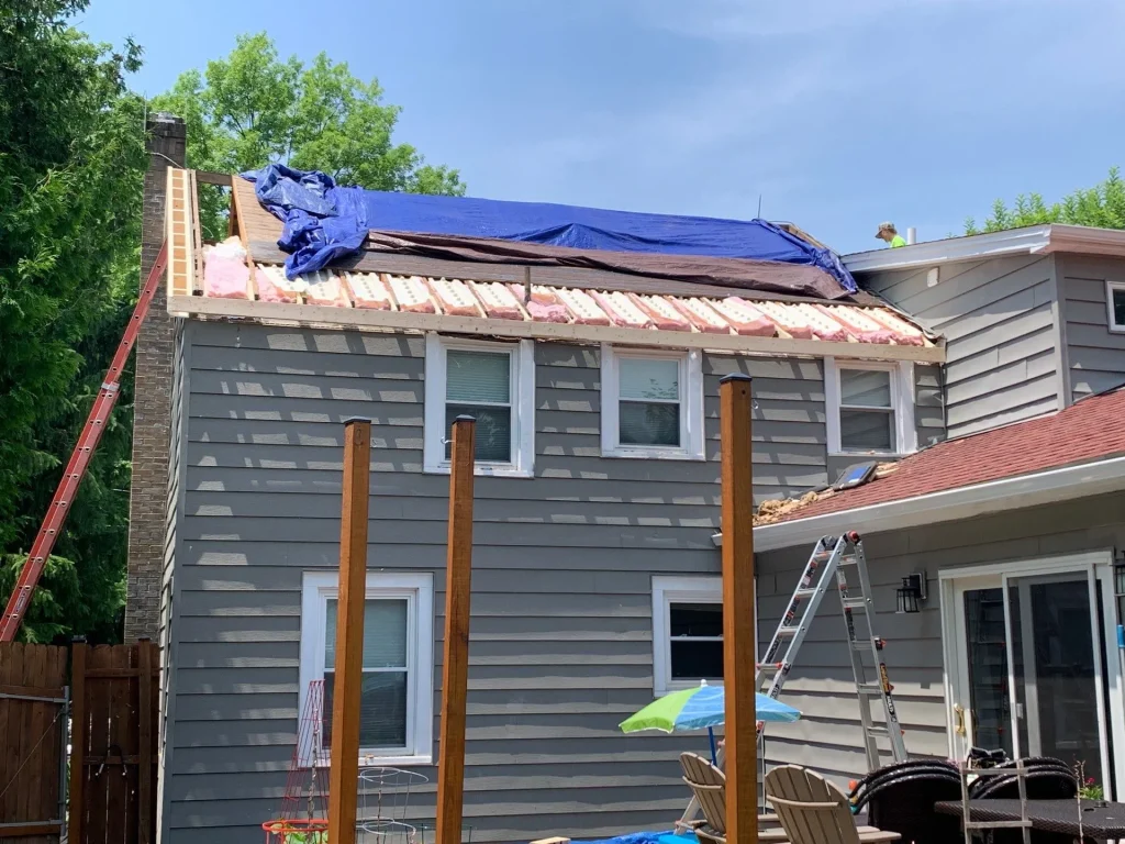 Roof tear-off and eave reconstruction in progress on a Hamburg, NY home